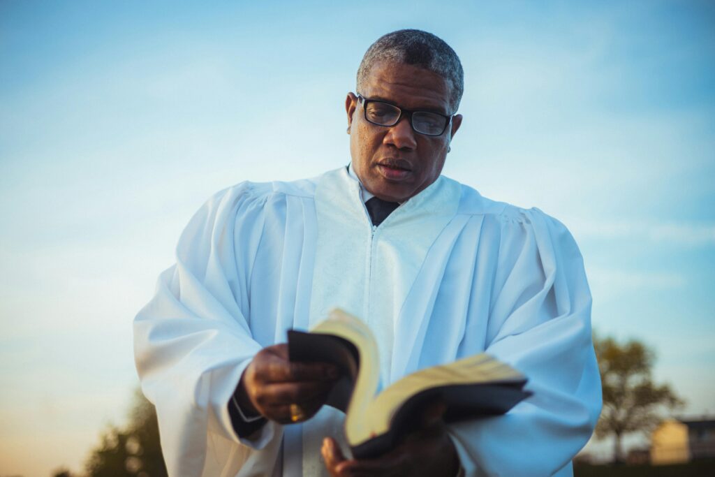 Pastor preparing for a sermon by reading a bible